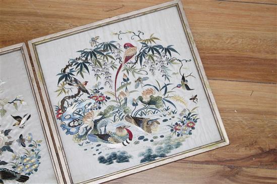 A set of four Chinese silkwork panels depicting birds and flowers, housed back to back in two frames, c.1910, 26.5 x 27cm